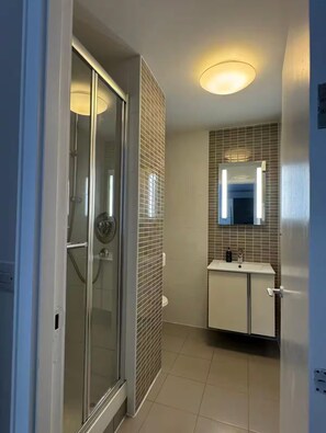 Shower, towels, soap, toilet paper