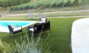A poolside area with a pool, two lounge chairs, and a well-maintained lawn. - Studio 'Domaine De La Chambarde' with Mountain View, Wi-Fi and Air Conditioning (Létra)