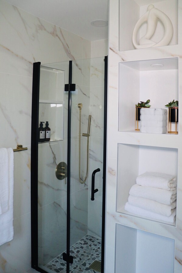 Shower, hair dryer, towels, soap