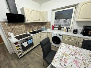 Fridge, toaster, cookware/dishes/utensils