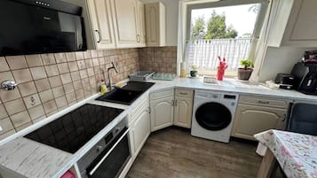 Fridge, toaster, cookware/dishes/utensils