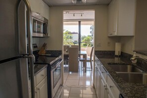 Fridge, coffee/tea maker, cookware/dishes/utensils