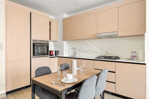 Dining - Modern 1BR in JVC with Pool Gym and Parking (Dubai)
