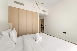 Desk, iron/ironing board, travel crib, WiFi - Modern 1BR in JVC with Pool Gym and Parking (Dubai)