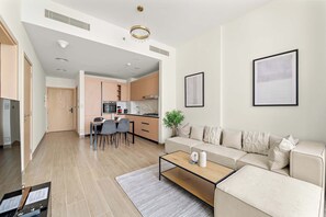 TV, offices - Modern 1BR in JVC with Pool Gym and Parking (Dubai)