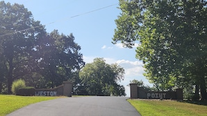 A paved entrance with two gates labeled "WESTON" and "POINT".