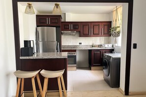 Fridge, microwave, oven, cookware/dishes/utensils