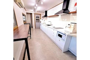 Fridge, microwave, stovetop, coffee/tea maker