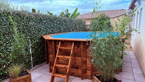 A wooden playhouse with a blue roof and a ladder. - Maison Avalone in the heart of the Ardèche Gorges! (Vallon-Pont-d'Arc)
