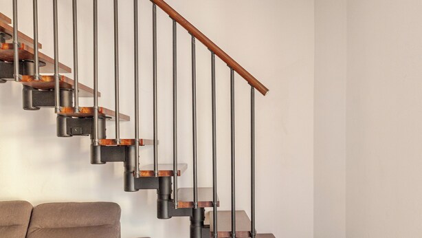 A modern staircase with wooden steps and metal railings, leading to a landing area. - Cadrezzate With Osmate (VA) (Osmate)