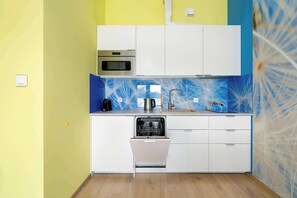Fridge, stovetop, dishwasher, coffee/tea maker