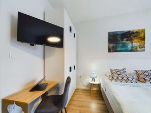 Iron/ironing board, travel crib, WiFi, bed sheets