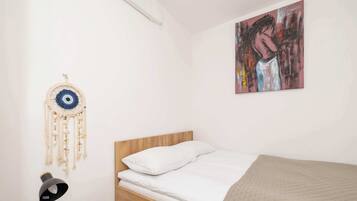 1 bedroom, desk, iron/ironing board, travel crib