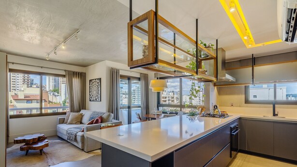 A modern kitchen with a large island, built-in appliances, and large windows offering city views. - Comfort and a Beautiful View! Pgr1101 (Porto Alegre)