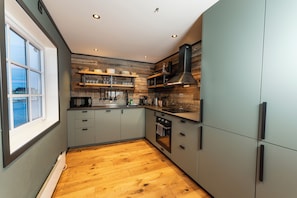 Apartment Kvalvika | Private kitchen | Full-size fridge, toaster, cleaning supplies