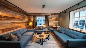 Apartment Kvalvika | Living area | Flat-screen TV, heated floors