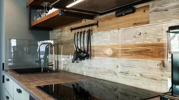 Full-size fridge, toaster, cleaning supplies