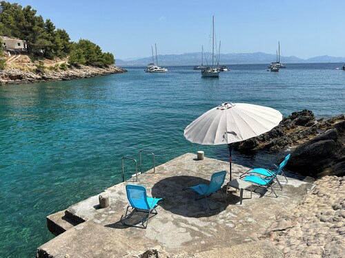 Charming 2-bedroom house in wonderful Rogač with AC situated 30 metres from sea.