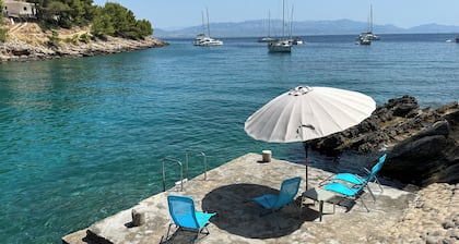 Charming 2-bedroom house in wonderful Rogač with AC situated 30 metres from sea.