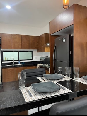 Microwave, stovetop, dishwasher, coffee/tea maker