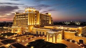 A large, well-lit hotel with a prominent conference center and a landscaped courtyard. - Sheraton Nouakchott Hotel (Nouakchott)