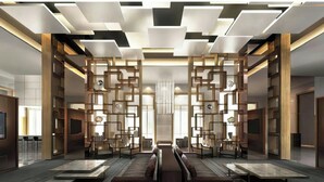 A modern hotel lobby with a central seating area, wooden paneling, and a contemporary ceiling design. - Sheraton Nouakchott Hotel (Nouakchott)