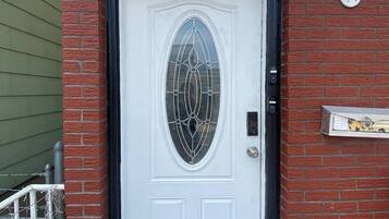 A white door with a glass panel and the number 819 above it.