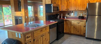 Charming 2-bedroom farmhouse in Hertel with AC and near lakes and trails
