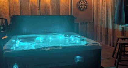 Relax with an enclosed hot tub and cozy island vibes in the heart of Summerside