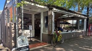 A restaurant named 'North Spoon' with a bicycle parked outside and a signboard.