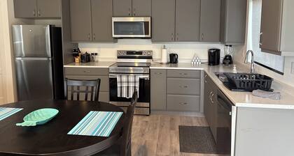 Cozy Fully Furnished 2-Bedroom Suite with Wifi, Parking and private entrance.