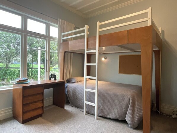 A bunk bed room with a desk and a window. - Comfortable family home with rural outlook near village (Havelock North)