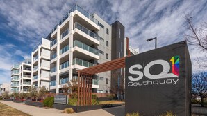 A modern multi-story building with balconies, a sign reading "SO Southay", and a clear sky. - The Greenway Edit Canberra, ACT (Greenway)