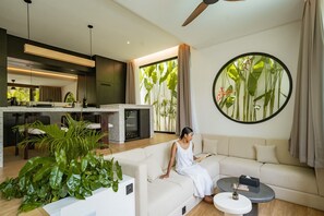 Deluxe Villa, 2 Bedrooms, Patio, Pool View | Living room | 65-inch TV with cable channels