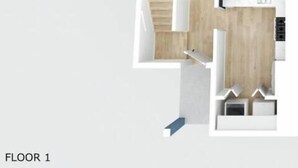 Distribución de un apartamento de una habitación, con sala, cocina y un pequeño comedor.