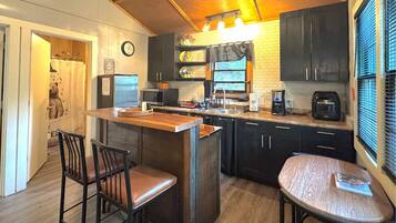 Microwave, coffee/tea maker, toaster, cookware/dishes/utensils