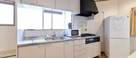 Fridge, microwave, cookware/dishes/utensils