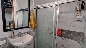 Shower, hair dryer, towels, soap