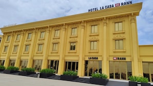 A yellow building with the signs "Hotel La Casa De Rann" and "Time Square." - LA CASA DE RANN (Bhuj)