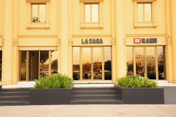 A building with two entrances labeled 'LA CASA' and 'DE RANN'. - LA CASA DE RANN (Bhuj)