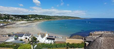 On the beach, windsurfing