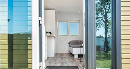 Tiny Home 'Surfbrett 2' mit Gemeinschaftsgarten und WLAN