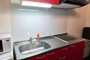 Fridge, microwave, cookware/dishes/utensils