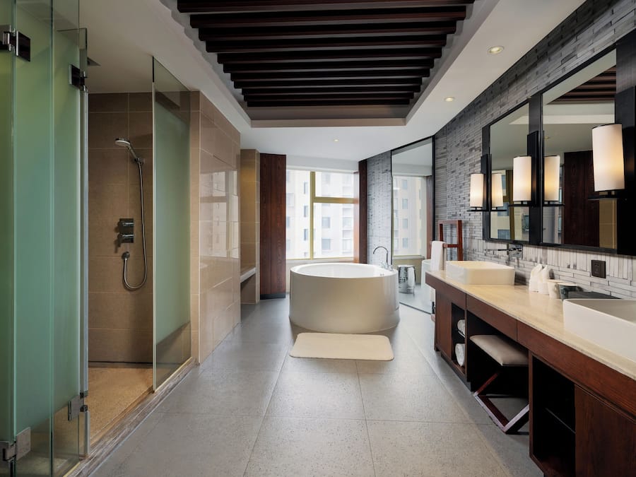 Classic Suite | Bathroom | Hair dryer, slippers, towels, soap