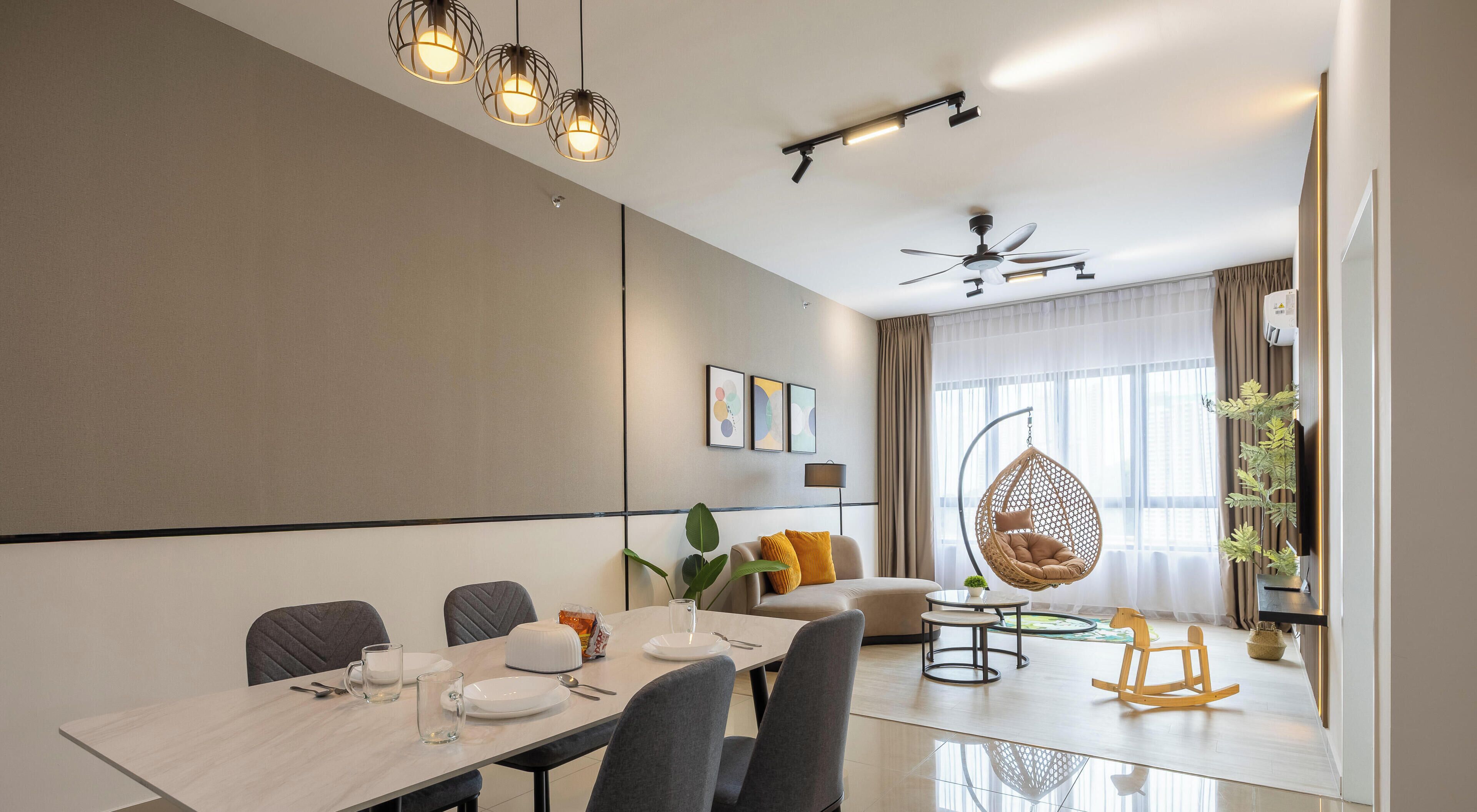 A modern dining area with a table set for four, a hanging chair, and a ceiling fan.