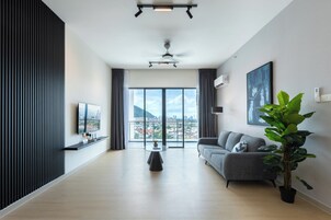 Executive Apartment, 3 Bedrooms, City View | Living area | 40-inch Smart TV with digital channels