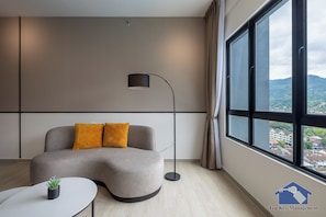 Deluxe Apartment, 2 Bedrooms, City View | Living area | 40-inch Smart TV with digital channels
