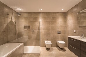 Hair dryer, bidet, towels, toilet paper