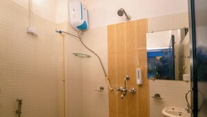 A bathroom with a shower, toilet, and sink. - Venice View Hotel & Restaurant (Udaipur)
