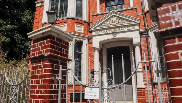 A red brick building with a sign reading "Hatcham Liberal Club" and "Hatcham House" indicating a historical building.